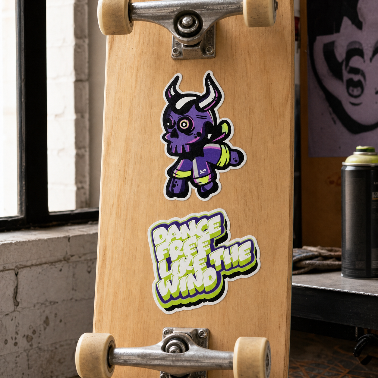 Trillela and Dance Free Like The Wind vinyl stickers on a skateboard