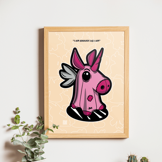 Framed artwork of a pink creature with wings on a wall above a wooden table with a camera and plants.